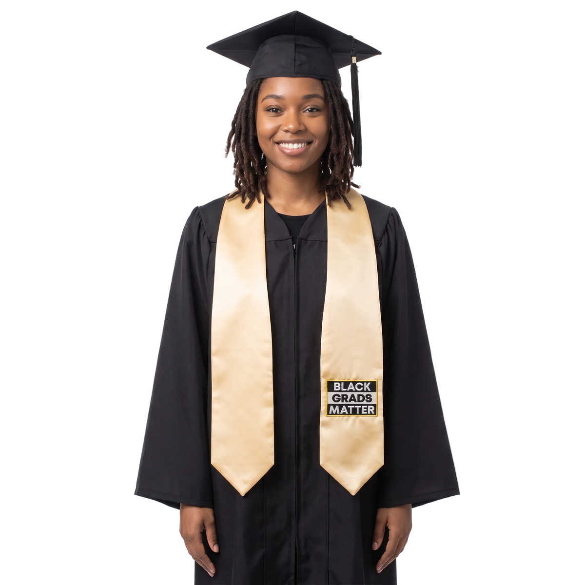Antique gold graduation stole with pointed ends and a black-and-white BLACK GRADS MATTER patch on one side.
