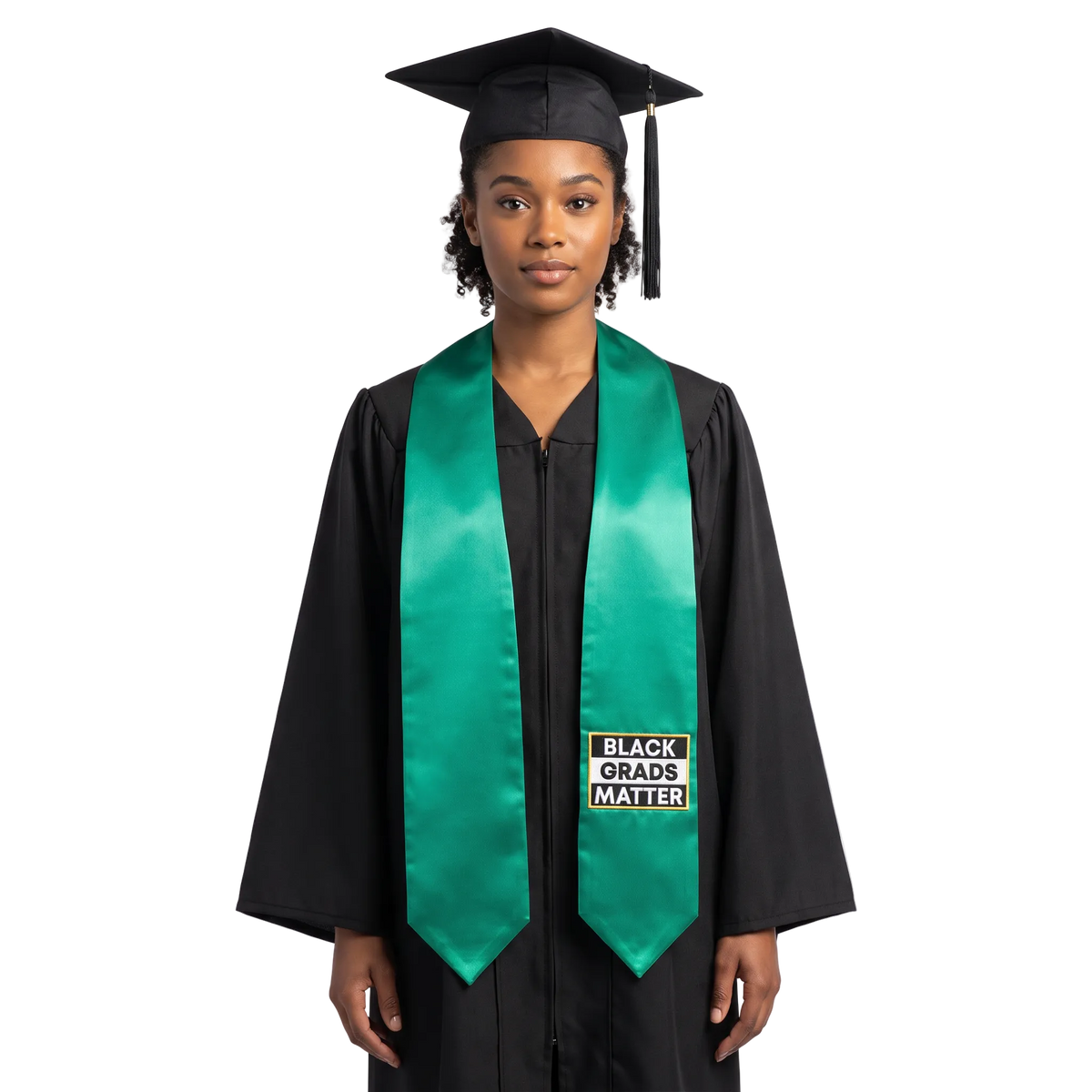 Emerald green graduation stole with pointed ends and a black-and-white BLACK GRADS MATTER patch with a gold border on one side.
