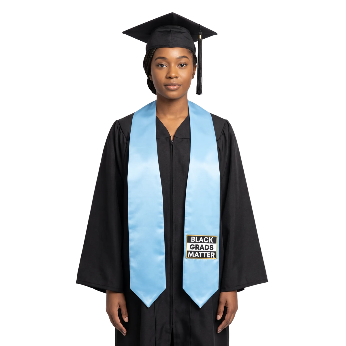 Light blue graduation stole with pointed ends and a black-and-white BLACK GRADS MATTER patch with a gold border on one side.
