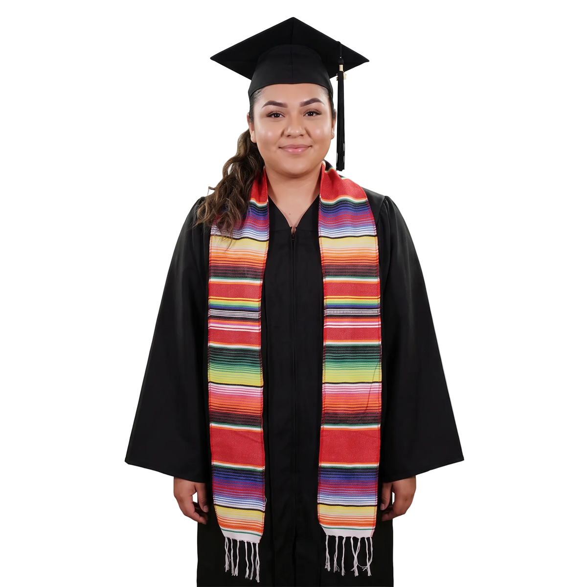 Model wearing a red Mexican serape graduation stole with multicolored stripes and white fringe over a black cap and gown.
